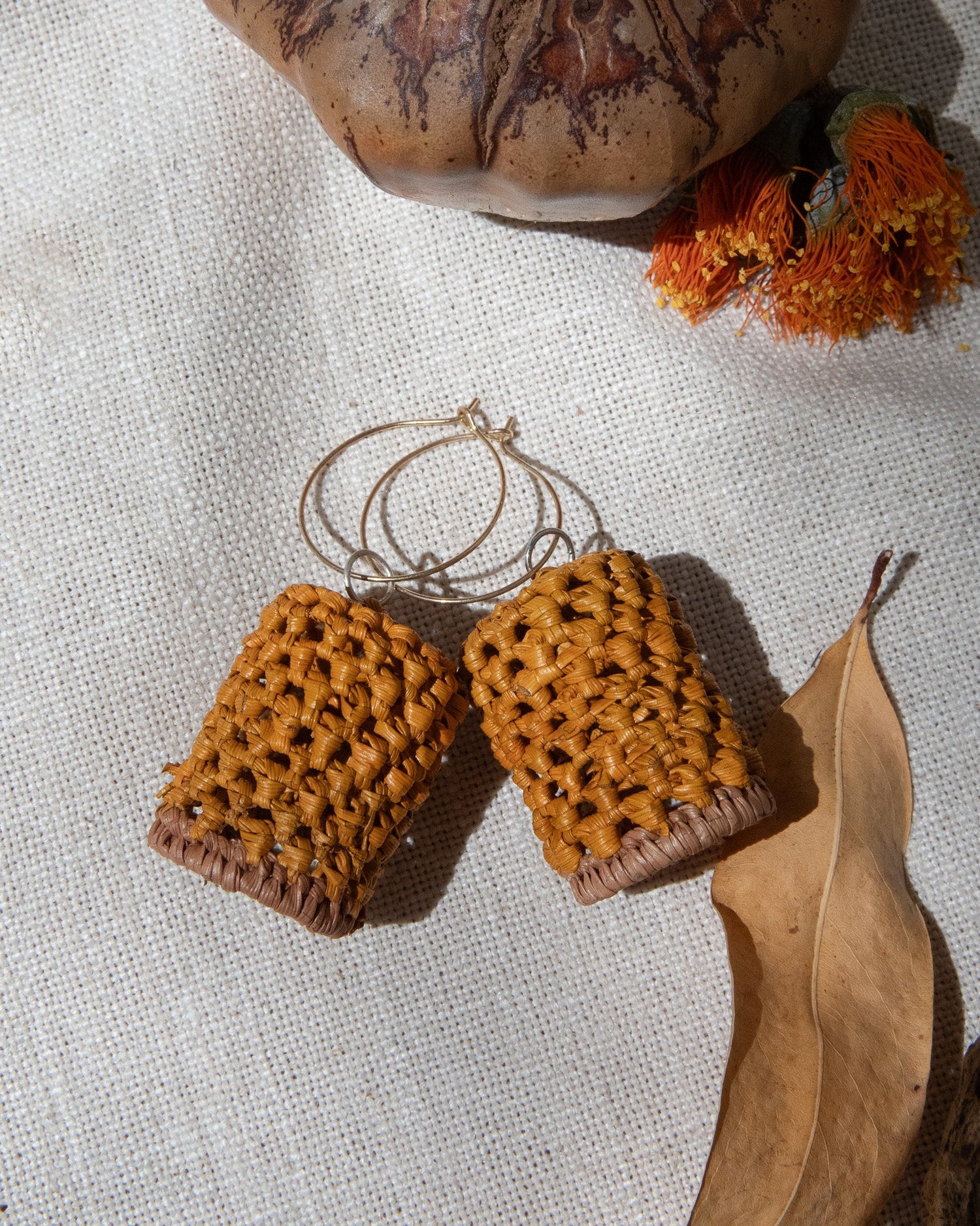 Pandanus grass earrings and necklaces woven by hand by local Bininj Artists.
